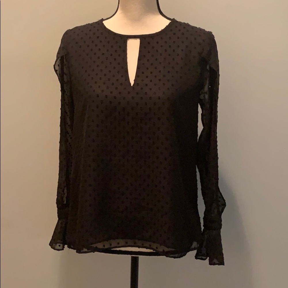 Flowy black top with slit sleeves and ruffle